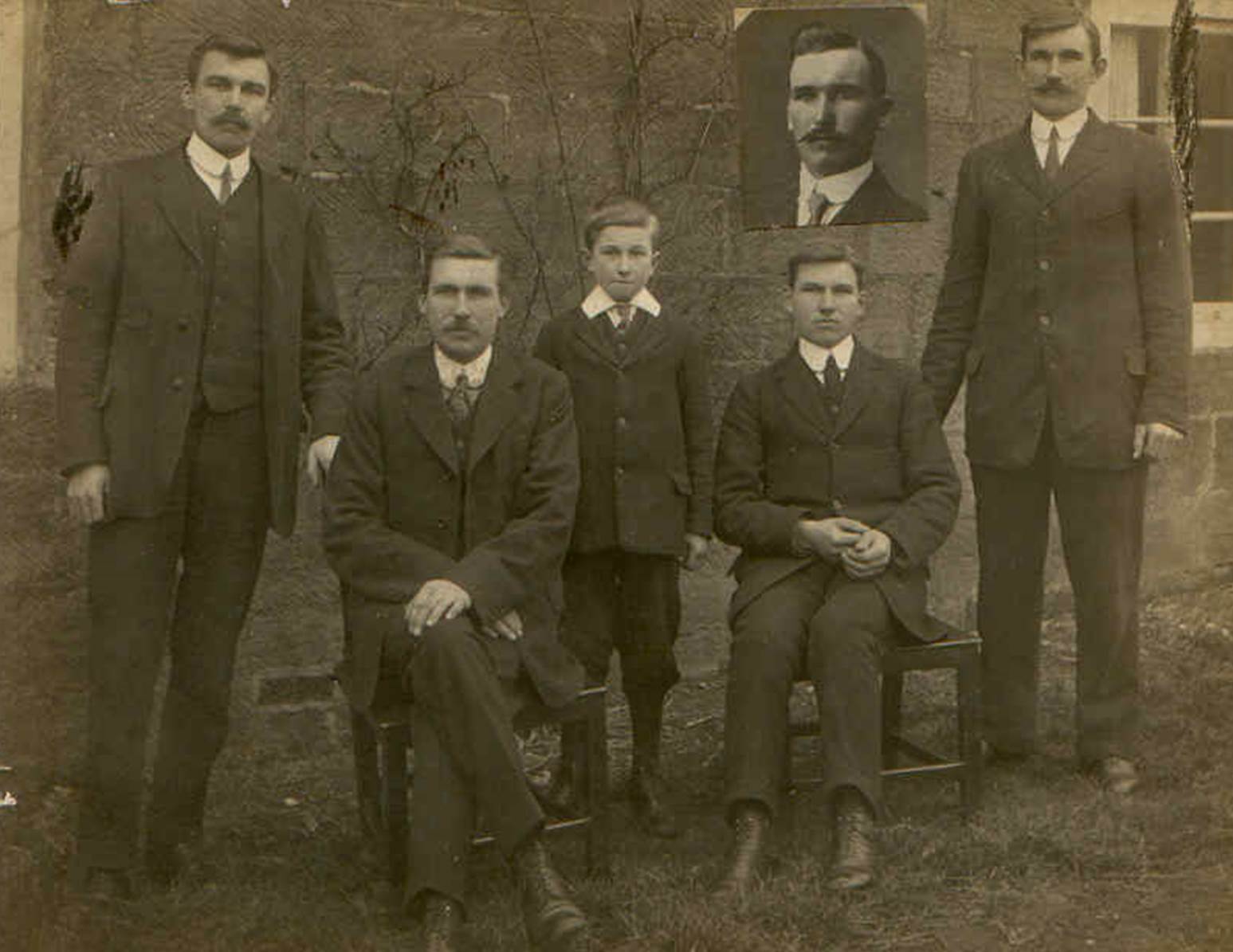 A group of people posing for a photo
Description automatically generated